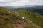 A woman leaves after a church service at Ekuphakameni Nazareth Baptist Church.