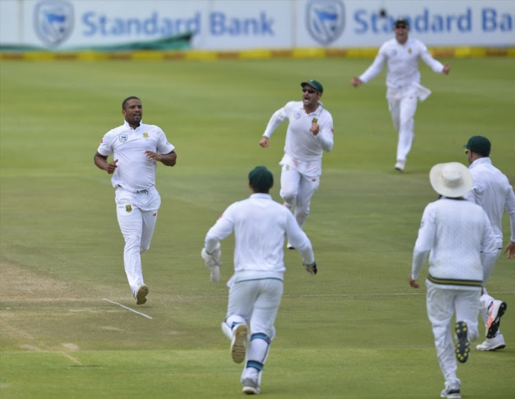 Vernon Philander of South Africa and team mates celebrate the wicket of Virat Kohli (capt) of India during day 4 of the 1st Sunfoil Test match between South Africa and India at PPC Newlands on January 08, 2018 in Cape Town.