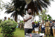 Ugandan presidential candidate Robert Kyagulanyi Ssentamu, known as Bobi Wine, reacts after casting his ballot in the presidential elections in Kampala, Uganda, January 14, 2021