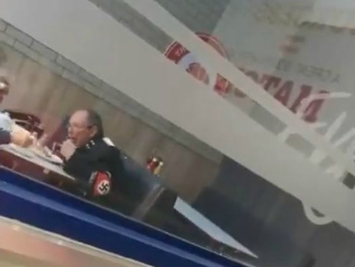 A screengrab of the video which has gone viral. It shows a man in a Nazi uniform having a meal at the Wimpy in Fleurdal Mall, Bloemfontein, on June 22 2019.