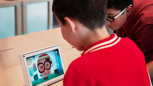 Young visitors using the video calling device portal.