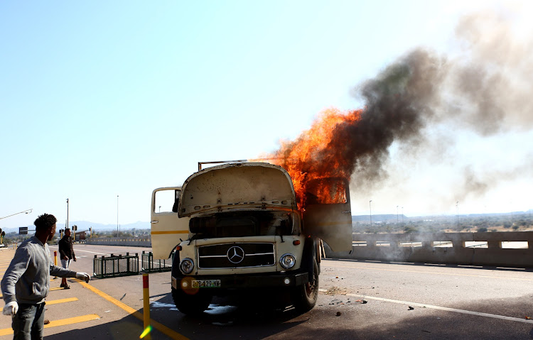 Residents of Majakaneng in the North West burn a truck during a protest over a man who was killed by a farmer.