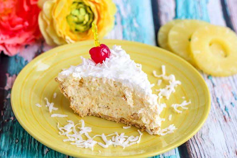 A Slice Of Hawaiian Pie On A Plate.