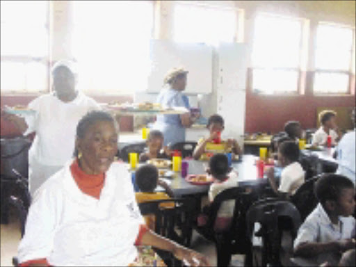 GOOD WORK: Caregivers of the Lusito Community Upliftment Project in Zondi, Soweto, serve lunch to some of the 350children they feed every day after school. 11/02/09. Pic. Lindi Obose. © Sowetan.