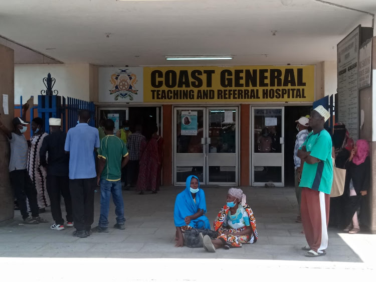 Patients stranded outside the main entrance of the Coast General Teaching and Referral Hospital in Mombasa on Monday after health workers went on strike.