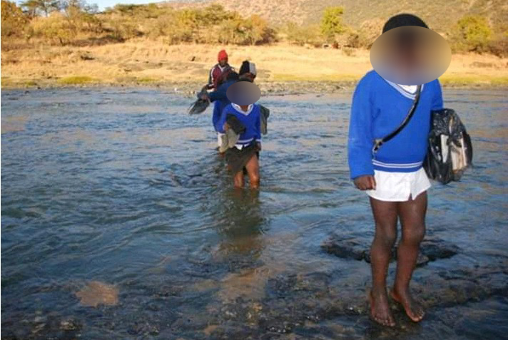 The KZN education department has called for an investigation after this photo, showing pupils crossing a river on foot, went viral.