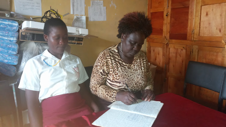 Rosebella Owino and Namatotoa Secondary School principal Judith Wangwe