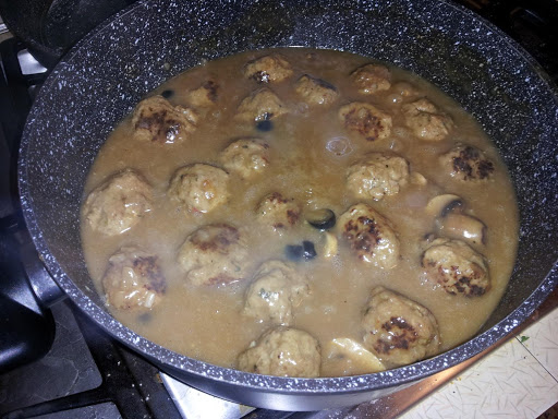 This isn't a fast meal, as the meatballs are homemade, gravy is still thickening up in this picture. Has about an hour to simmer left. You can serve this over noodles, rice, or mashed potatoes.