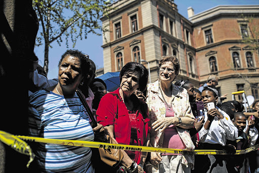 FACES IN A CROWD: A large number of people gathered outside the High Court in Pretoria on Friday to catch a glimpse of Oscar Pistorius leaving. He is out on R1-million bail