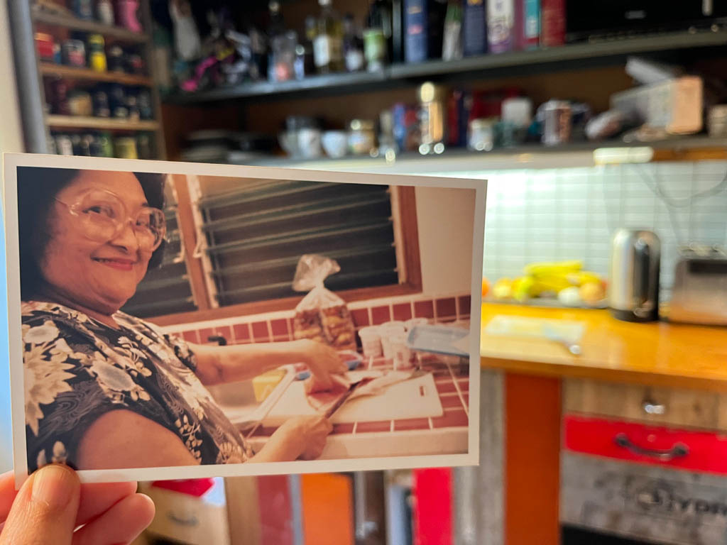 Rae’s gramma, gleefully gutting fish in her kitchen in Hilo (1998), haunting Rae’s kitchen in Stockholm (2023). Photo by Rae.