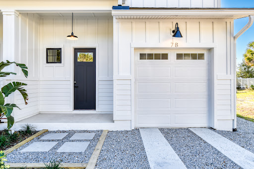 White house with gray door and garage - Prestige house for sale in St. Augustine, 3 bedrooms