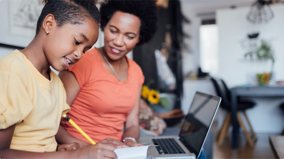 Adult helping a child to do the homework