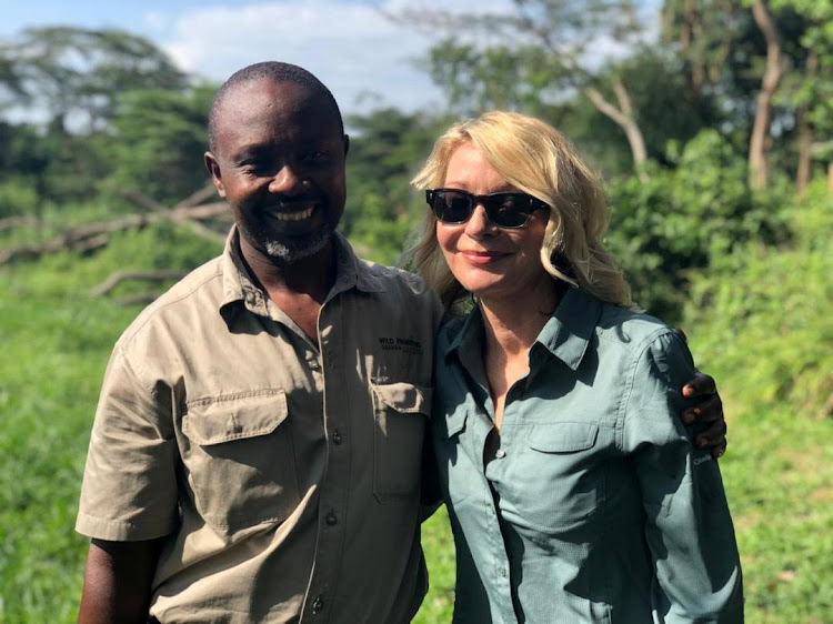 US tourist Kimberly Sue Endicott poses with her guide Jean Paul Mirenge in Uganda, on April 7 2019, in this image taken from social media.