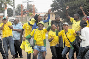 STAUNCH SUPPORTERS:    Mamelodi Sundowns fans protest outside Dobsonville police station where six of their friends had  handed themselves over to police   in connection with  violence at Dobsonville Stadium. 
      PHOTO: VELI NHLAPO