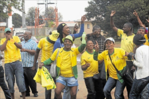 STAUNCH SUPPORTERS: Mamelodi Sundowns fans protest outside Dobsonville police station where six of their friends had handed themselves over to police in connection with violence at Dobsonville Stadium. PHOTO: VELI NHLAPO