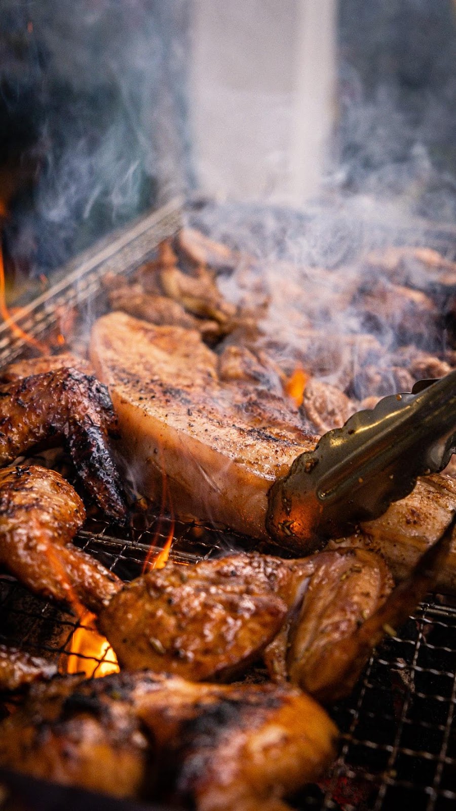 grilled meat on charcoal grill