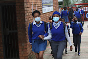 Tlhatlogang Junior Secondary School pupils head to the first day of classes. 