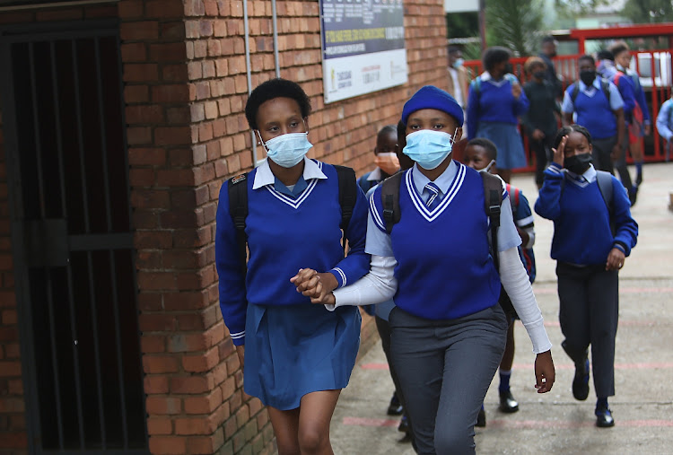 Tlhatlogang Junior Secondary School pupils head to the first day of classes.