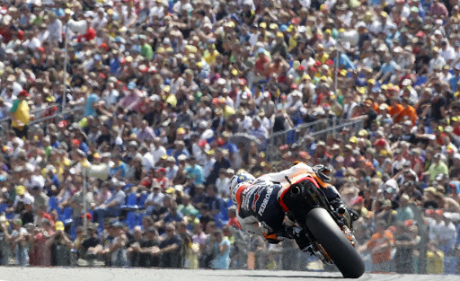 Honda MotoGP rider Dani Pedrosa of Spain rides during the qualifying round for the German Grand Prix at the Sachsenring circuit in the eastern German town of Hohenstein-Ernstthal, July 16, 2011