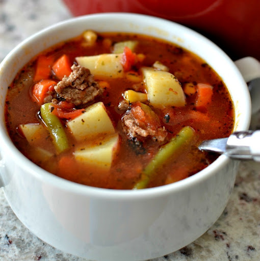 Easy Hamburger Vegetable Soup is family friendly, super simple and good anytime of the year. It is the perfect blend of ground beef and garden fresh vegetables. I love to serve this with a warm crusty baguette or Cheddar Drop Biscuits with Chive Butter.