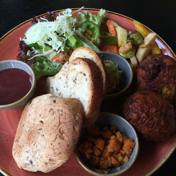 Indian: Bondas, Omnik Houria, Tamarind-Plum-Chutney, Mungbean spread, marinated veggies, gluten free bread.