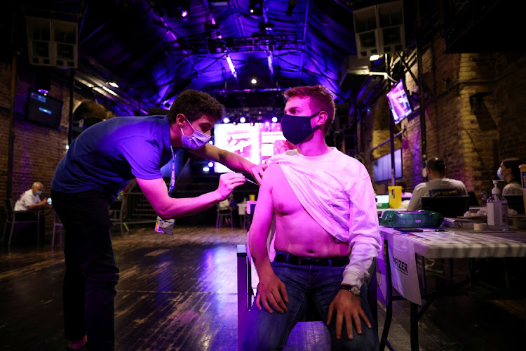 A person receives a dose of the Pfizer vaccine at an NHS vaccination centre at the Heaven nightclub in London, Britain, in this August 8 2021 file photo. Picture: Picture: REUTERS/HENRY NICHOLLS