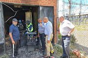 Alfred Duma municipality officials inspect the substation that went up in flames, leaving thousands without power.