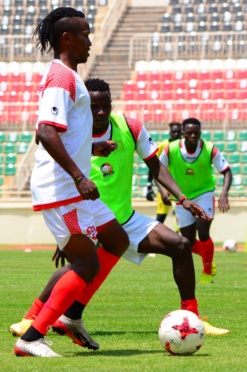 Francis Kahata (L) challenges Cliff Nyakeya during a training session at Nyayo Stadium yesterday