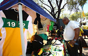 Hawkers ply their trade on the sidelines of  the 54th ANC National Elective Conference held at Nasrec on 18 December 2017.