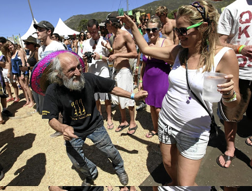 Papa Smurf and other revellers shake their booties at Rocking the Daisies in Darling.