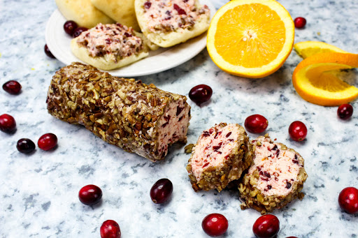 Cranberry Orange Pecan Butter with two slices cut.