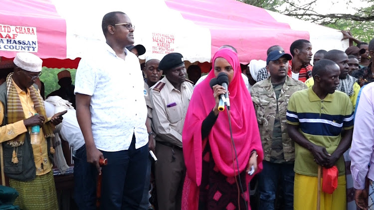 Tana River county assembly speaker Osman Galole with Woman Rep Amina Dika at Mandingo village during official handing over water pumps to 15 villages