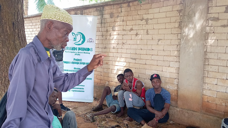 Kaya elder Mohammed Sibabu speaks to young people in Kombani, Kwale county, on Monday, April 15, 2024.