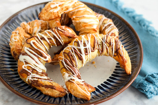 A plate of Chocolate and Butterscotch Stuffed Croissants.