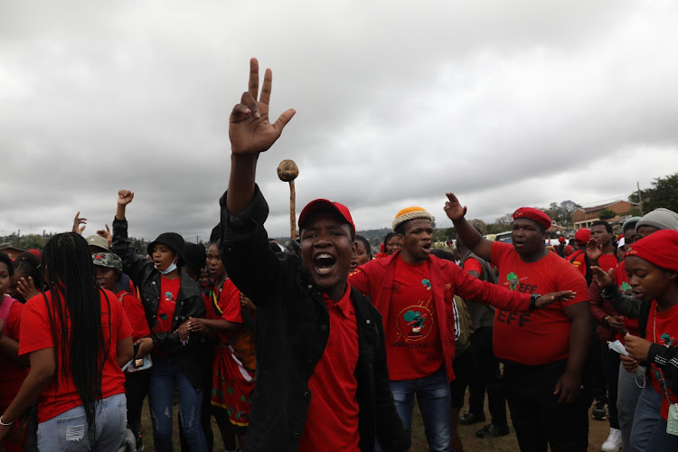 EFF supporters listened to party leader Julius Malema as he delivered his election rally speech at Inanda Comprehensive School's sports ground.