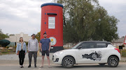 Nadia Romanos, Jude van Wyk and Nick Hamman in front of the Flower Post Box in Calvinia. 