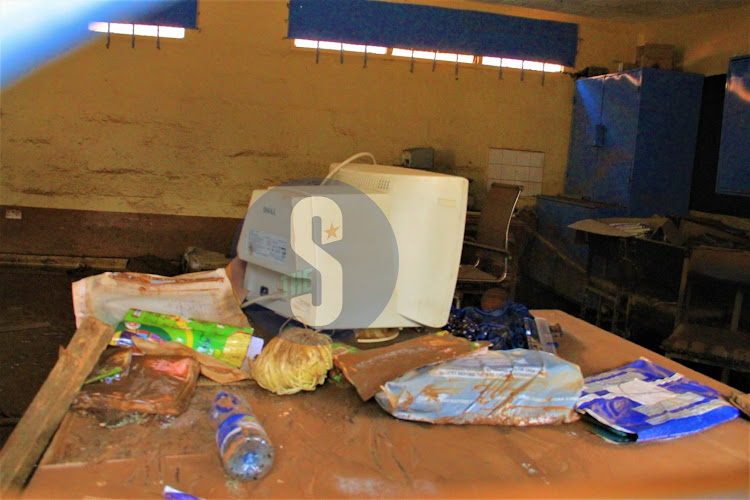 Smudged books and computer inside a muddy classroom at Mathare North Primary School affected by floods, May 3, 2024.