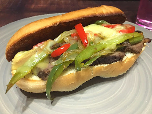 A delicious Philly Cheesesteak with melted cheese