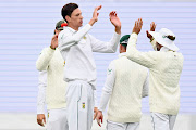 Marco Jansen of SA is congratulated by teammates after dismissing Henry Nicholls of New Zealand during day two of the Second Test Match in the series between New Zealand and South Africa at Hagley Oval.