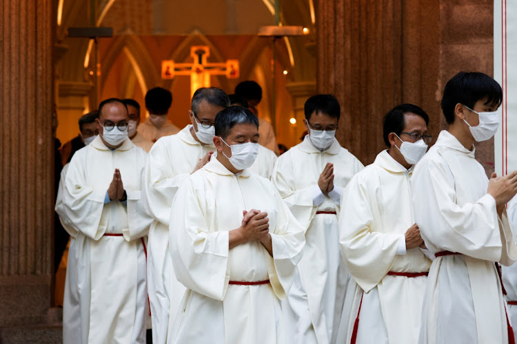 Catholic priests at the ordination of Bishop Stephen Chow in Hong Kong on December 4. Picture: TYRONE SIU/REUTERS