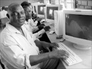 NEW HORIZONS: Steve Sefofa and fellow pupils at Masopha High prepare to work on computers for the first time. Eskom gave 20 computers to the school. Pic. Alex Matlala. © Sowetan.