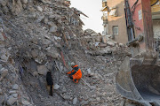 A volunteer and search dog at the site of a collapsed building in Hatay, Turkey, on Sunday, February 12 2023.