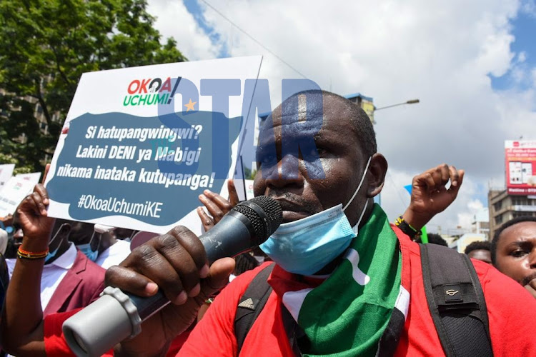 Activist Wilfred Olal during a peaceful demonstration with members of the public and conveners of the OKOA Uchumi Coalition at National Treasury house on December 9, 2021.