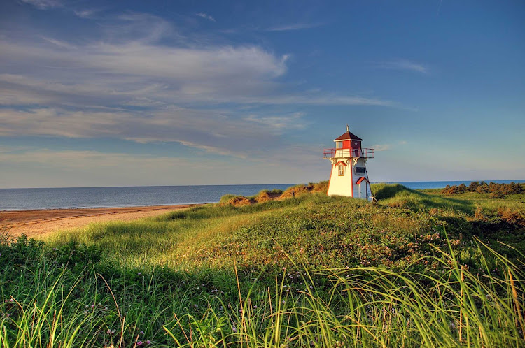 Covehead Harbour Lighthouse stands astride the entrance to Covehead Bay inside Prince Edward Island National Park in Canada. 