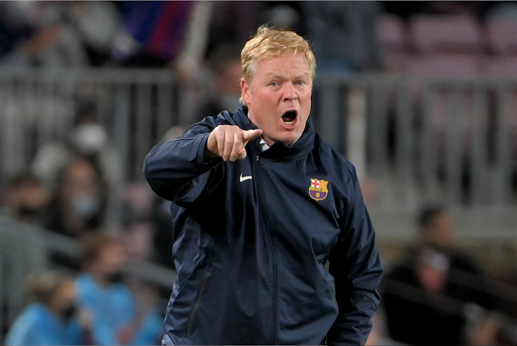 Barcelona's Dutch coach Ronald Koeman reacts during a Spanish La Liga match against Granada at the Camp Nou stadium