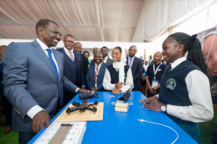 President William Ruto being taken through an exhibition at Uhuru Gardens, Nairobi during the opening of Connected Africa Summit 2024 on April 22, 2024.