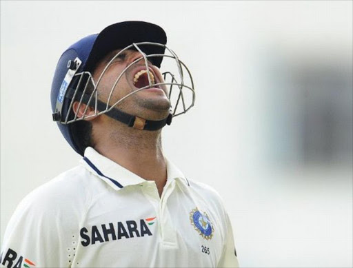 Indian batsman Suresh Raina reacts after loosing his wicket during the first day of the first test match between West Indies and India at Sabina Park in Kingston, Jamaica, June 20, 2011