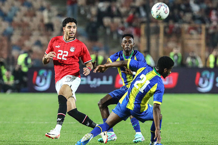 Tanzania’s Charles M’Mombwa (21) vies for the ball with Omar Marmoush of Egypt during an international friendly match on January 7