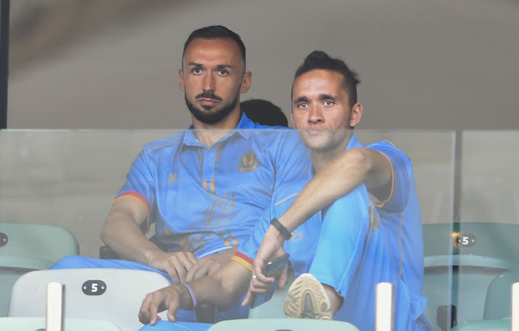 Royal AM's Samir Nurković and Sedwyn George sit in the stands during a Caf Confederation Cup preliminary round match against Mbabane Highlanders of Eswatini at Durban's Moses Mabhida Stadium on September 16 2022.