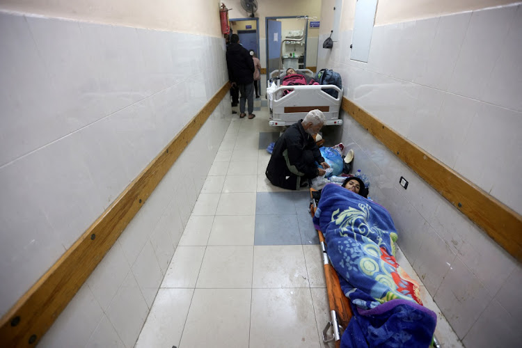 Palestinians wounded in an Israeli strike lie in corridor at Nasser hospital in Khan Younis in the southern Gaza Strip January 12, 2024.